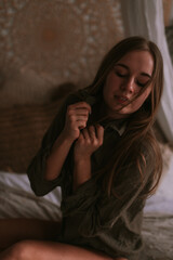 Young woman in the bedroom