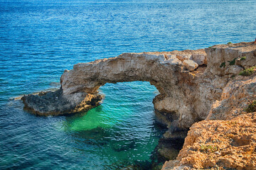 Beautiful mountain rocks against the background of the blue sea. Summer landscape