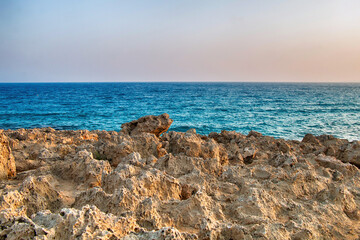 Fototapeta na wymiar Beautiful mountain rocks against the background of the blue sea. Summer landscape