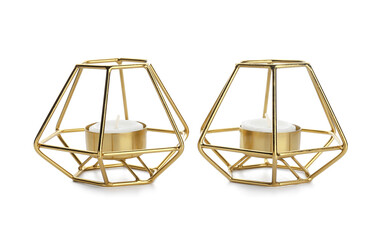 Candles in holders on white background