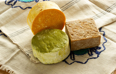 Various handmade aromatic soaps on linen