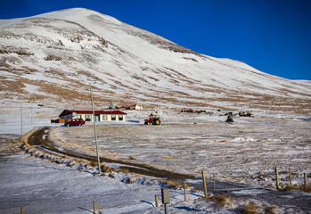 Few houses exist near Myvatn, Iceland, surrounded by snow