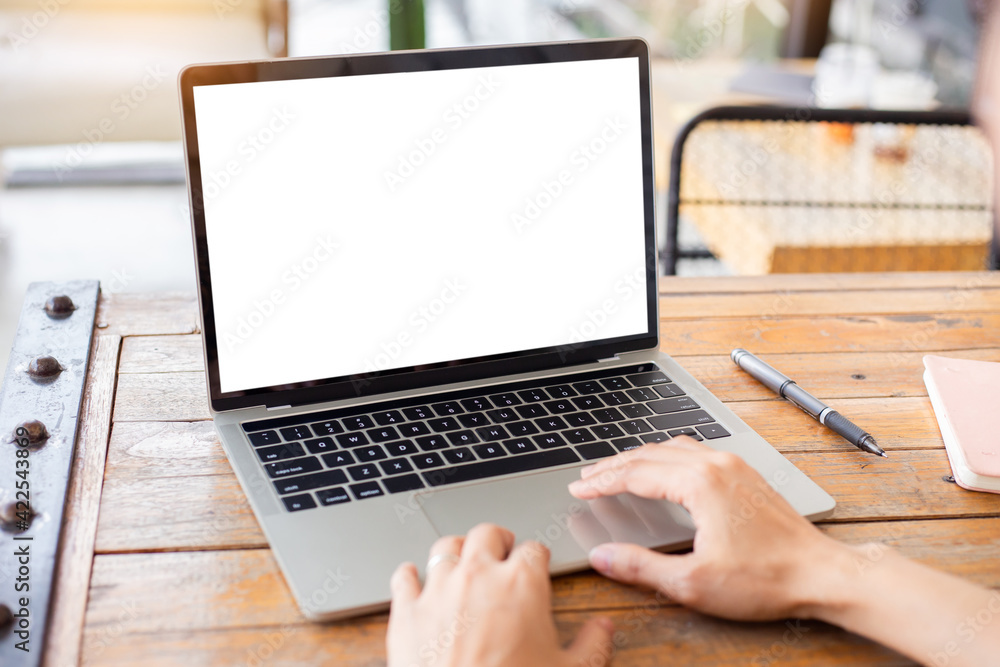 Wall mural computer screen blank mockup.hand woman work using laptop with white background for advertising,cont