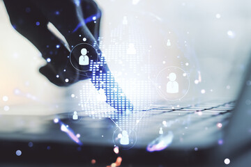 Social network concept with world map and hands typing on laptop on background. Multiexposure