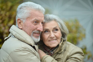 smiling senior couple   in autumn  park