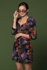 smiling girl in colorful dress with sunglasses
