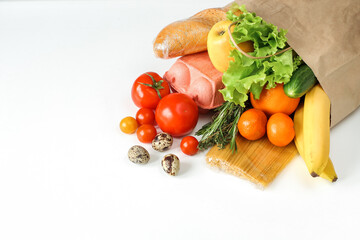 food supply, food delivery by a volotner from the market, a paper bag with purchases. copy of the space