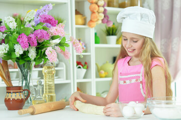 young girl baking  in the kitchen