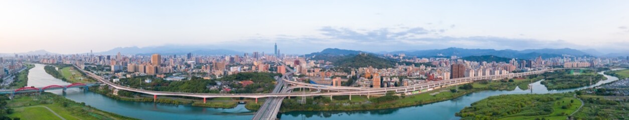 Taipei City Aerial View - Asia business concept image, panoramic modern cityscape building bird&rsquo;s eye view under sunrise and morning blue bright sky, shot in Taipei, Taiwan