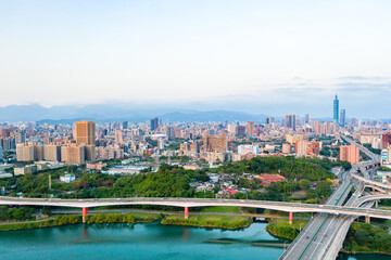 Fototapeta na wymiar Taipei City Aerial View - Asia business concept image, panoramic modern cityscape building bird’s eye view under sunrise and morning blue bright sky, shot in Taipei, Taiwan