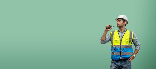 Engineer caucasian man use walkie-talkie isolated on soft green backgrounds, banner cover design.