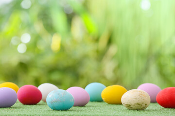 Beautiful Easter eggs on grass outdoors