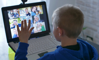 young boy is happy to greeting his parents on video call