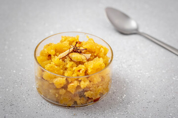 Moong Dal Halwa or Mung Daal Halva is an Indian dessert recipe, made with mung lentil, clarified butter and sugar, garnished with dry fruits