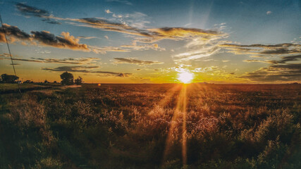 The sun setting over the Canadian prairies somewhere in Saskatchewan captured during a road trip