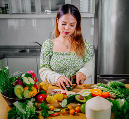 Asian girl cooking healthy vegetarian and vegan food, vegetables and fruits in the kitchen, healthy lifestyle