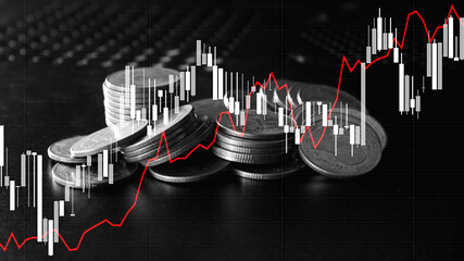 Stack of money coin with trading graph, financial investment concept with blue filter can be use as background