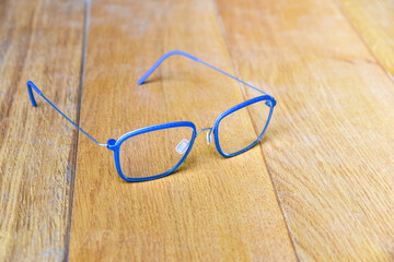 Clear eyeglasses, Glasses blue frame with wire strip modern style on wood background