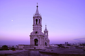 Dreamy Purple Colored Bell Tower of Basilica Cathedral of Arequipa on Early Morning Sky with the Bright Moon, Arequipa, Peru