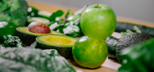 Healthy food clean eating selection: fruit, vegetable, seeds, superfood, leaf vegetable and mediterranean dishes. Detox and clean diet. Foods high in vitamins, minerals and antioxidants.