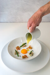 Chef serving asparagus cream