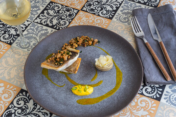 Grilled sea bream on a mosaic table
