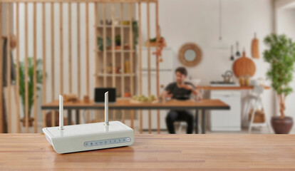 Modem and router box on the table and living room background blur concept. - obrazy, fototapety, plakaty