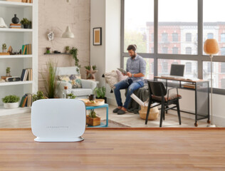 Modem and router box on the table and living room background blur concept. - obrazy, fototapety, plakaty