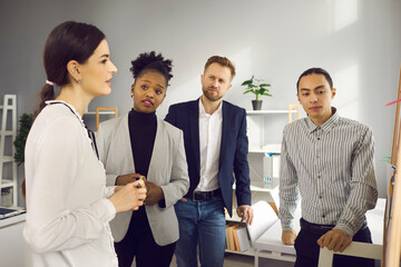 Multiracial people looking for business solution, brainstorming and discussing ideas in group...