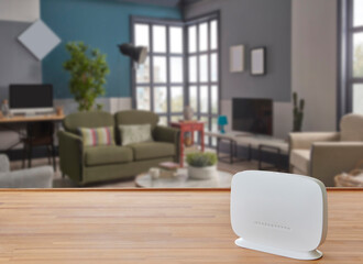 Modem and router box on the table and living room background blur concept.