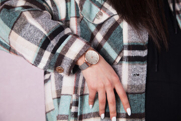 Beautiful watch in a young woman's hand.
