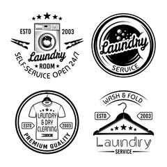 Laundry room and dry cleaning service set of four vector monochrome emblems, labels, badges isolated on white background