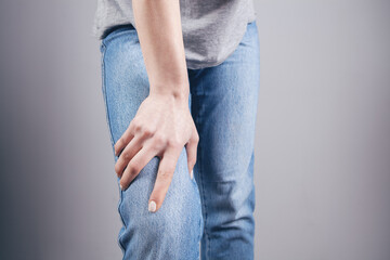 a young girl has a knee pain