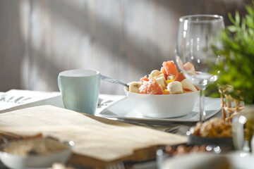 Spring breakfast on a wooden table in a mountain hut in the morning 