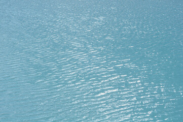 Bright, colorful background close up, turquoise green water surface lake, outdoors
