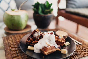 Delicious dessert with sweet topping placed on plate on table