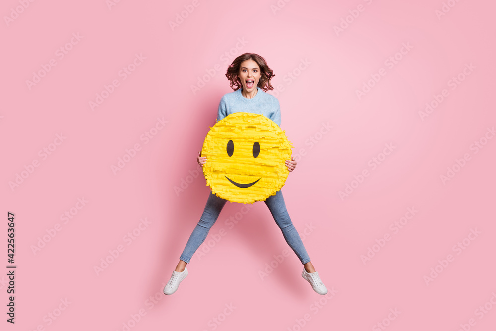 Sticker full length body size view of attractive cheerful girl jumping holding in hands face smiley isolated