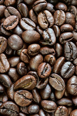 Brown roasted coffee beans background , beverage ingredients