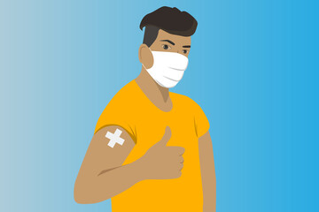 Man showing vaccinated arm.Man getting vaccinated.A man with yellow shirt and wear the face mask get the coronavirus vaccine .Person after receiving covid-19 vaccine on her arm.Vaccination concept.