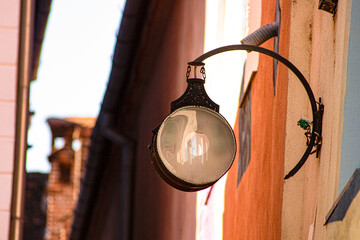 Close-up of lantern in narrow street of historical center 