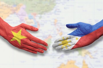 Vietnam and the Philippines - Flag handshake symbolizing partnership and cooperation