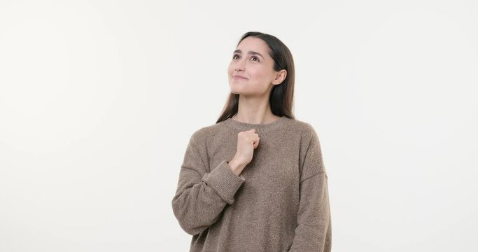 Confused woman coming up with a good idea over white background