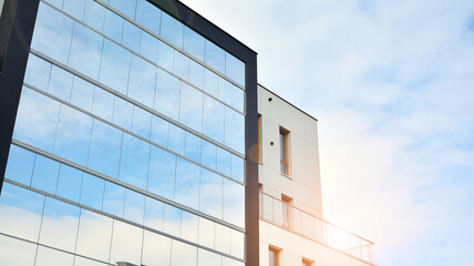 Part of city real estate property and condo architecture. Detail in modern residential flat apartment building exterior. Fragment of New luxury house and home complex. 