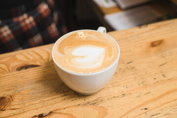 Delicious and aromatic cappuccino coffee on the table in a coffee shop