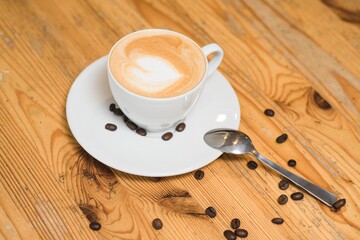 Delicious and aromatic cappuccino coffee on the table in a coffee shop
