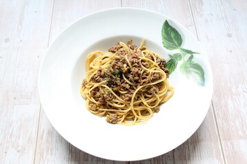 spaghetti pasta plate with meat sauce, white pasta plate, Italian dish, meat dish and carbohydrates