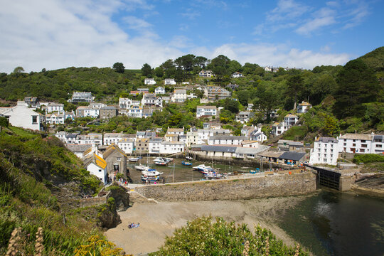 Polperro harbour Cornwall UK with beach and blue sky in summer