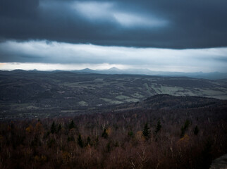 Amazing dark scenery and view to the deep valleys from top of mountains in north of Czech Republic.