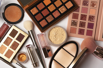 Kit of a makeup products on a grey background. Top view