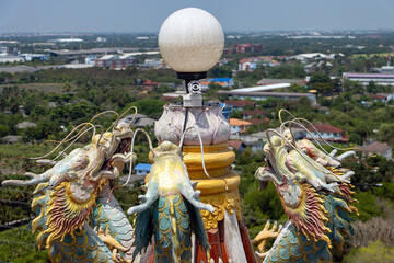 A colored Chinese dragon statues decorate the lamp on the rooftop, Wat Samphran Dragon Temple,...